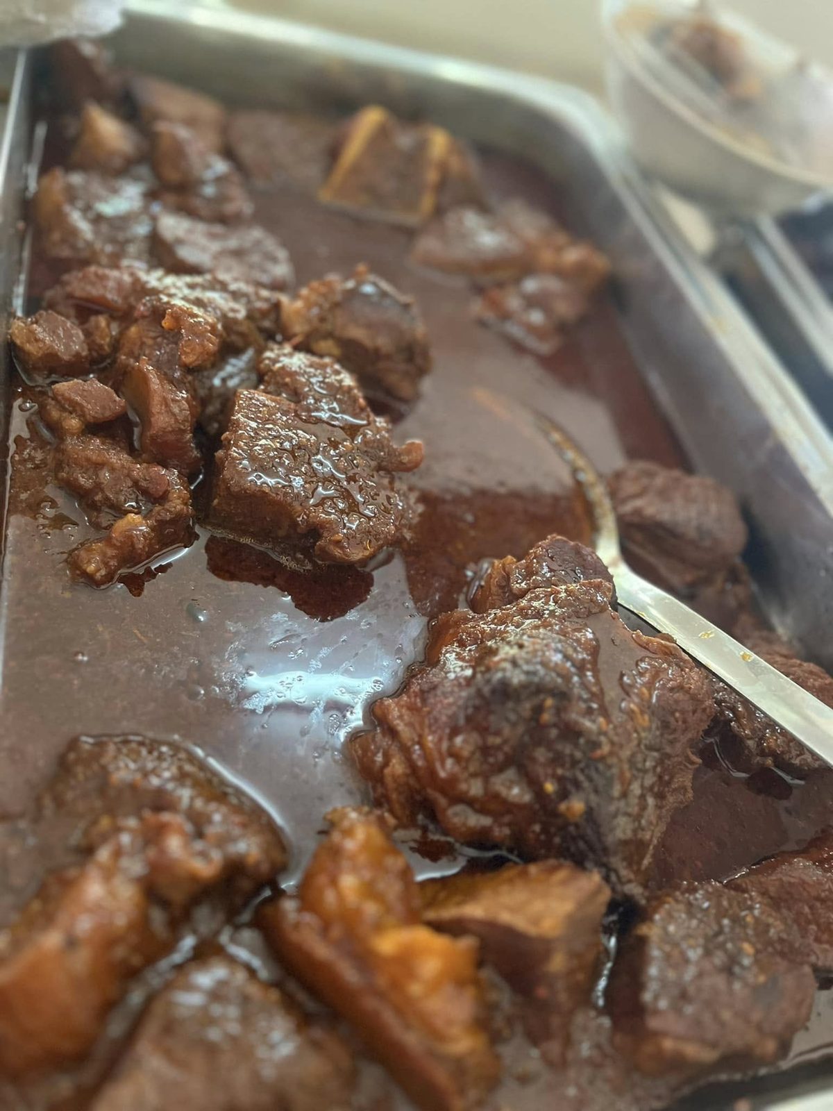Beef stew in a steel serving tray