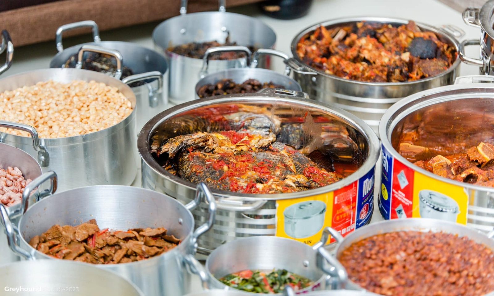 A spread of pots filled with stews and relishes